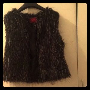 A black and white fur vest